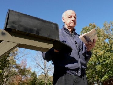Man Getting Mail from Mailbox