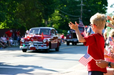 Boy Watching a Parade