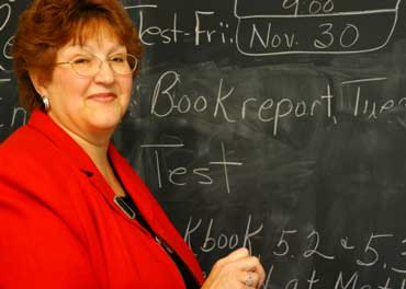 Teacher Writing on Board